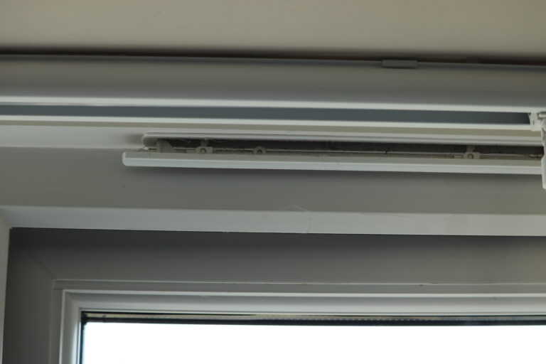 Air,Vent,Top,Of,White,Plastic,Window,Frame,To,Stop